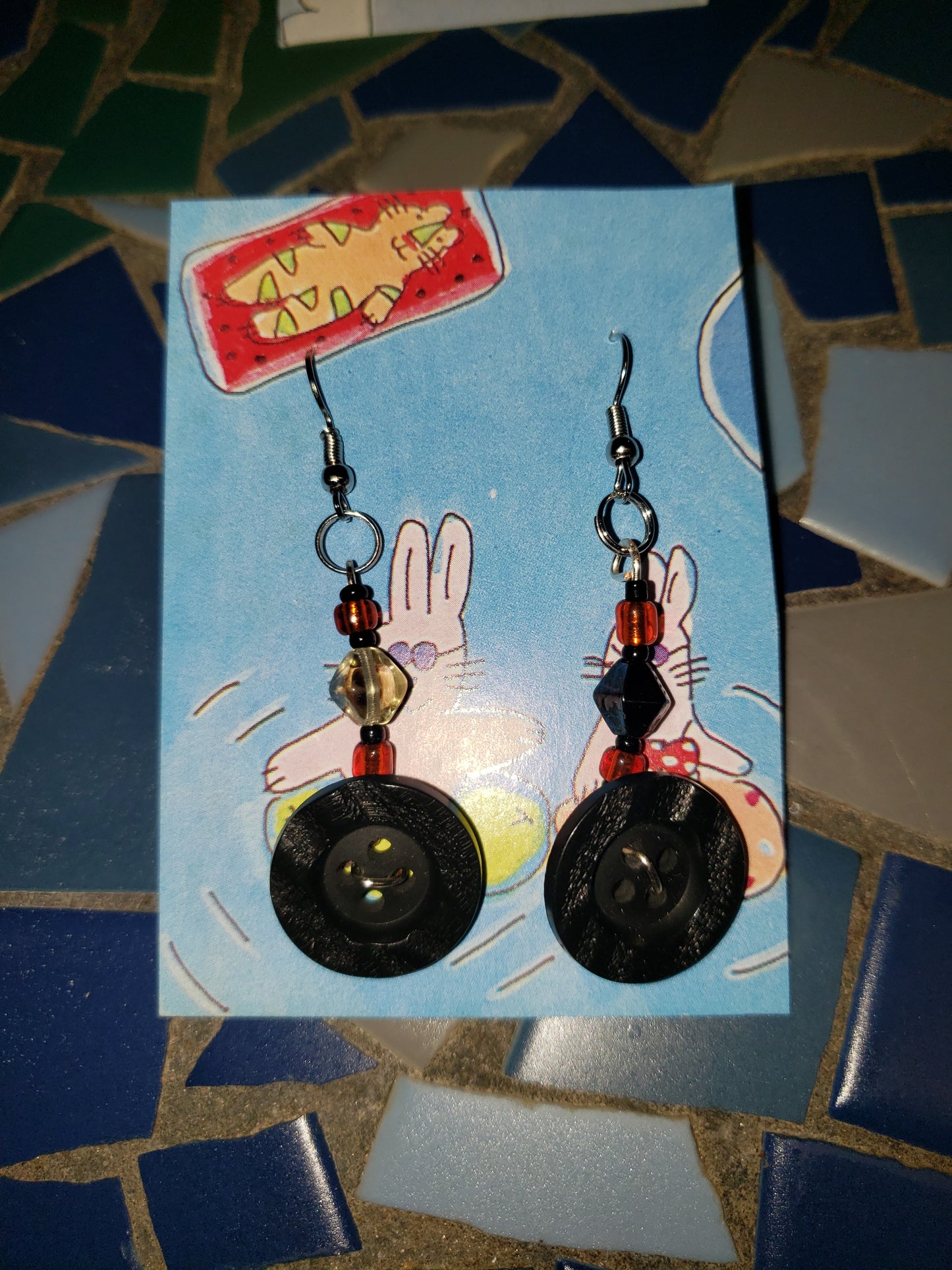 Black and red semi mismatch button earrings